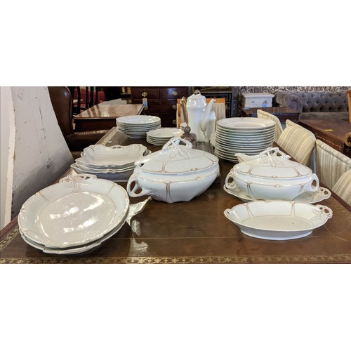 15 - PART DINNER SERVICE, Karlsbro Austria, including 14 plates and 7 soup bowls along with 2 lidded ture... 