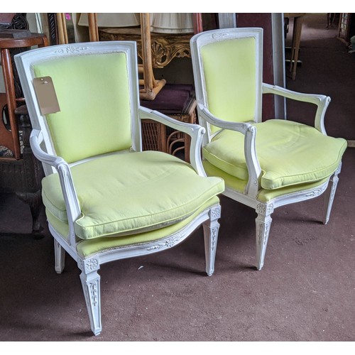 177 - FAUTEUILS, a pair, each 62cm x 93cm H, 20th century with white painted show frames and pale lime uph... 