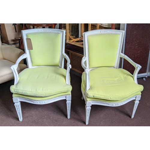 177 - FAUTEUILS, a pair, each 62cm x 93cm H, 20th century with white painted show frames and pale lime uph... 