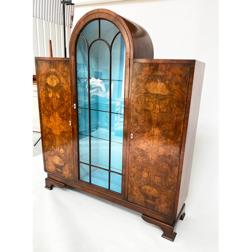 139 - ART DECO DISPLAY CASE, burr walnut with arch glazed, shelved section flanked by panelled doors, 122c... 