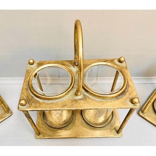 378 - STORM LANTERNS, 33cm x 27cm x 15cm, set of three, gilt metal with a handle to centre. (3)