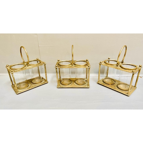 378 - STORM LANTERNS, 33cm x 27cm x 15cm, set of three, gilt metal with a handle to centre. (3)