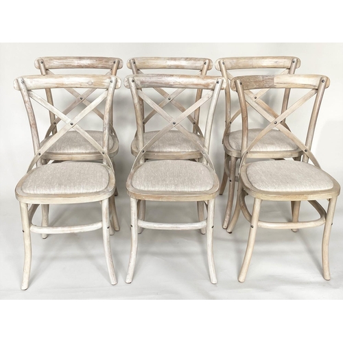 206 - OKA DINING CHAIRS, a set of six, lime washed fruitwood with X backs and linen seats. (6)