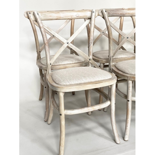 206 - OKA DINING CHAIRS, a set of six, lime washed fruitwood with X backs and linen seats. (6)