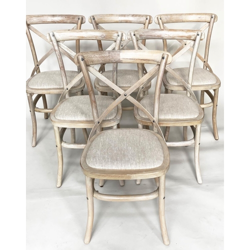 206 - OKA DINING CHAIRS, a set of six, lime washed fruitwood with X backs and linen seats. (6)