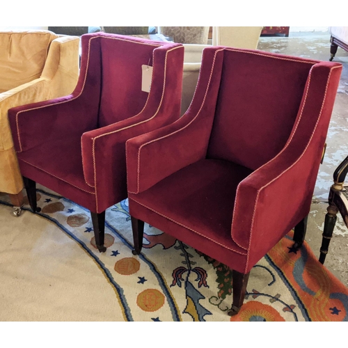 141 - ARMCHAIRS, 87cm H x 62cm W, a pair, Edwardian mahogany in red velvet on brass front castors and cera... 