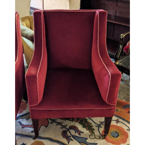 141 - ARMCHAIRS, 87cm H x 62cm W, a pair, Edwardian mahogany in red velvet on brass front castors and cera... 