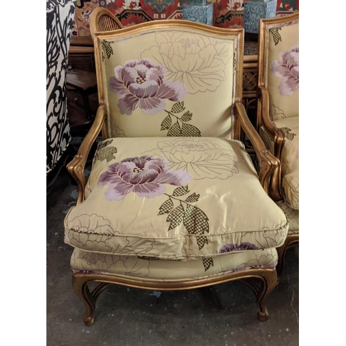 180 - FAUTEUILS, a pair each 97cm W x 97cm H, reproduction in Louis XV style with gilt frames and silk uph... 