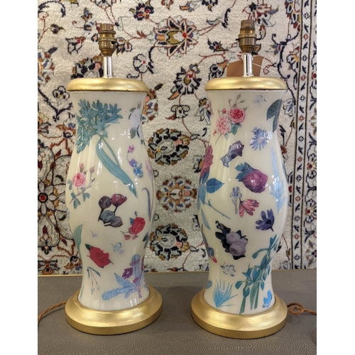 194 - TABLE LAMPS, a pair, each base 46cm H in a floral and gilt design. (2)