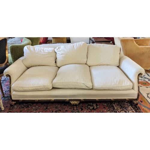 196 - SOFA, 102cm x 73cm H x 193cm, in a cream self patterned fabric with reeded and carved wooden showfra... 