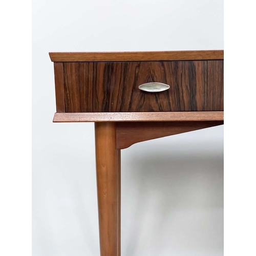 312 - HERBERT E GGIBBS WRITING TABLE, 1960s teak and Indian laurel with three frieze drawers and tapering ... 