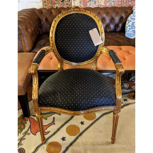 425 - FAUTEUIL, gilt 62cm W x 100cm H with black patterned upholstery.