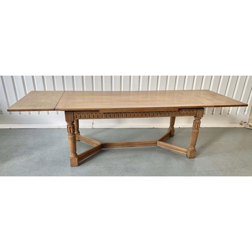 101 - DRAW LEAF EXTENDING DINING TABLE, early 20th century oak, rectangular cleated stretched supports and... 