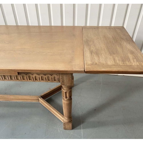 101 - DRAW LEAF EXTENDING DINING TABLE, early 20th century oak, rectangular cleated stretched supports and... 