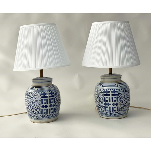 106 - TABLE LAMPS, a pair Chinese ceramic blue and white lidded jar form, geometric panels with shades, 60... 