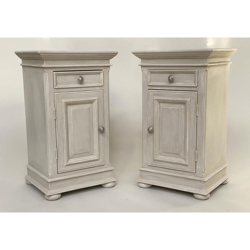 111 - BEDSIDE CABINETS, a pair French style traditionally grey painted each with drawer and panelled door,... 