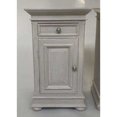 111 - BEDSIDE CABINETS, a pair French style traditionally grey painted each with drawer and panelled door,... 