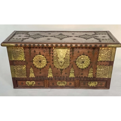 117 - ZANZIBAR TRUNK, early 20th century hardwood and brass mounted with three drawers and rising lid, 133... 