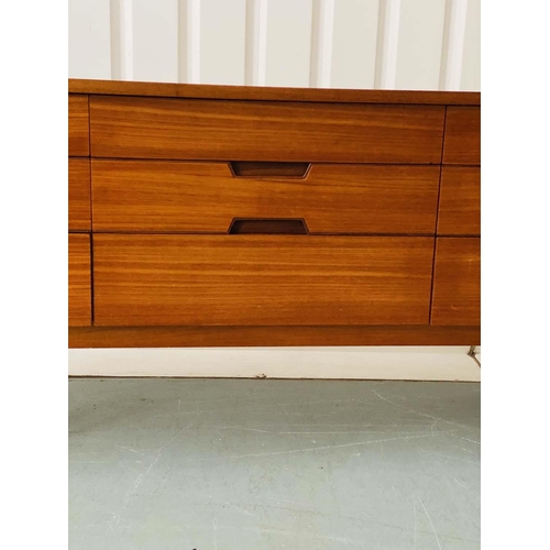 301 - UNIFLEX LOW CHEST, 1970s teak with nine drawers, recessed contrast wood handles and loop supports, 1... 