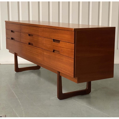 301 - UNIFLEX LOW CHEST, 1970s teak with nine drawers, recessed contrast wood handles and loop supports, 1... 