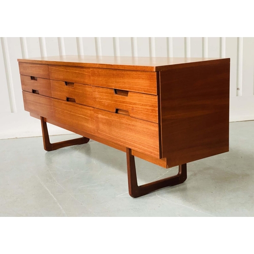 301 - UNIFLEX LOW CHEST, 1970s teak with nine drawers, recessed contrast wood handles and loop supports, 1... 