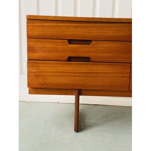 301 - UNIFLEX LOW CHEST, 1970s teak with nine drawers, recessed contrast wood handles and loop supports, 1... 