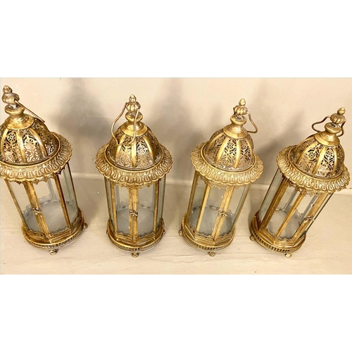 358 - CANDLE LANTERNS, set of four, 61cm H x 21cm D, gilt metal frames and glazed sides, pierced tops. (4)