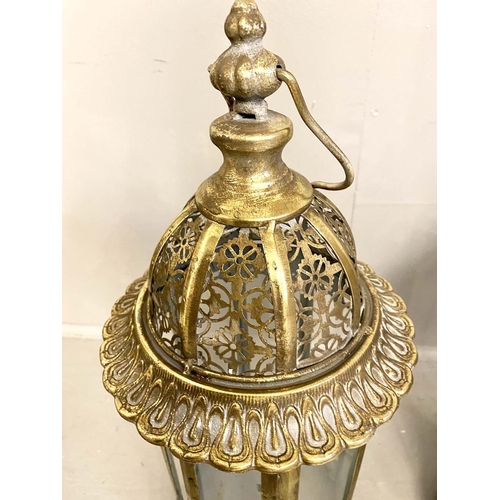 358 - CANDLE LANTERNS, set of four, 61cm H x 21cm D, gilt metal frames and glazed sides, pierced tops. (4)