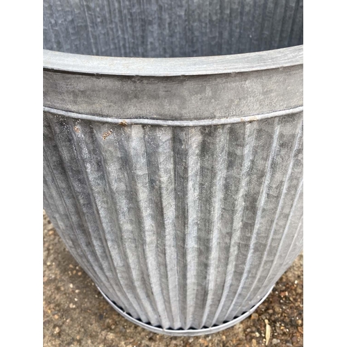 387 - TUB PLANTERS, graduated set of three, largest 50cm H x 45cm D, galvanised zinc. (2)