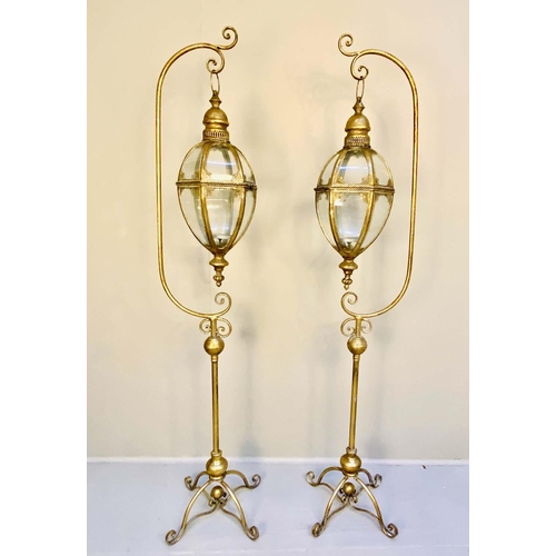 399 - LANTERNS ON STANDS, pair, 163cm H x 35cm W x 30cm D,  Regency style,gilt metal. (2)