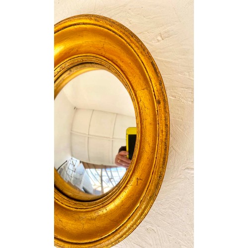 444 - CONVEX WALL MIRRORS, set of twelve, 26cm diam. at largest, Regency style gilt frames, of various siz... 