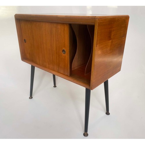 308 - CABINET, 1950s walnut with two sliding doors and splayed brass tipped ebonised supports, 74cm W x 37... 