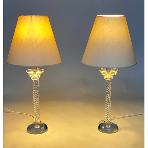 124 - TABLE LAMPS, a heavy pair lead glass with twist columns and solid cup bases with shades, 78cm H. (2)