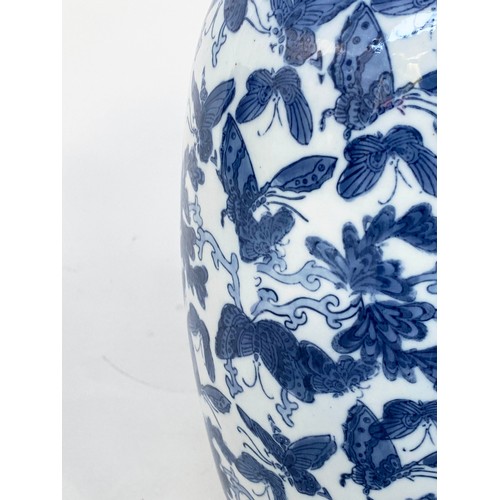 265 - BUTTERFLY VASE, Chinese blue and white ceramic with all over butterfly design, 52cm H.