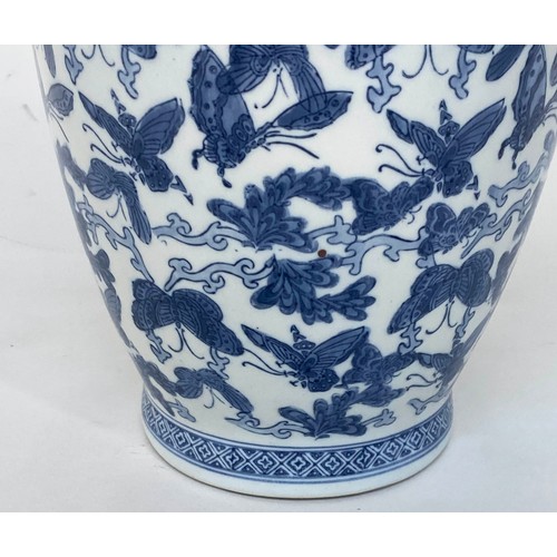 265 - BUTTERFLY VASE, Chinese blue and white ceramic with all over butterfly design, 52cm H.