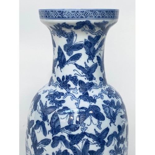 265 - BUTTERFLY VASE, Chinese blue and white ceramic with all over butterfly design, 52cm H.