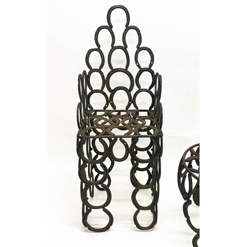 267 - 'HORSESHOE' GARDEN ARMCHAIR AND TABLE, constructed from welded iron horseshoes, chair 110cm H x 41cm... 