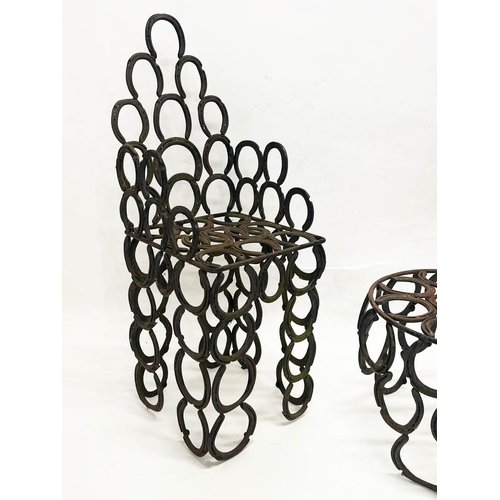 267 - 'HORSESHOE' GARDEN ARMCHAIR AND TABLE, constructed from welded iron horseshoes, chair 110cm H x 41cm... 