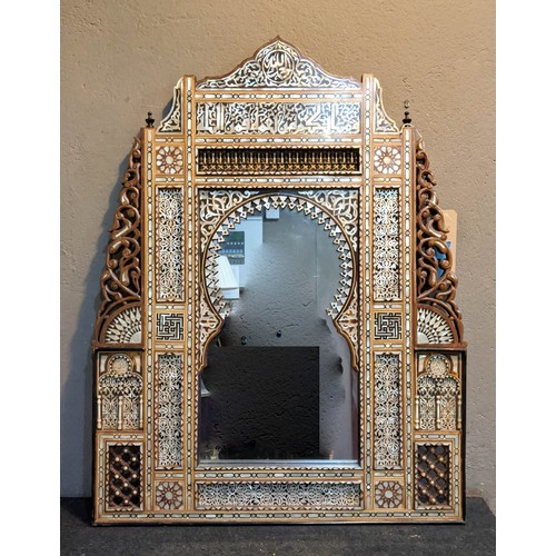 276 - WALL MIRROR, probably Syrian decoratively inlaid with mother of pearl and mother of pearl fretwork p... 