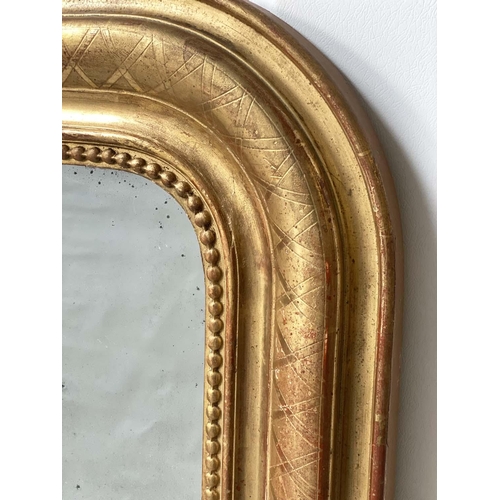 108 - OVERMANTEL MIRROR, 19th century French Louis Philippe giltwood arched with incised and beaded frame,... 