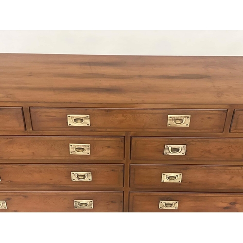 120 - LOW CHEST, Campaign style yewwood and brass bound with nine drawers, 150cm W x 71cm H x 43cm D.