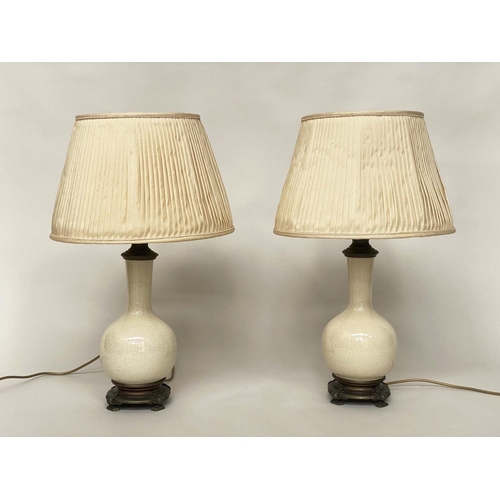 124 - TABLE LAMPS, a pair, cream crackelure ceramic and bronze mounted of gourd form with silk pleated sha... 