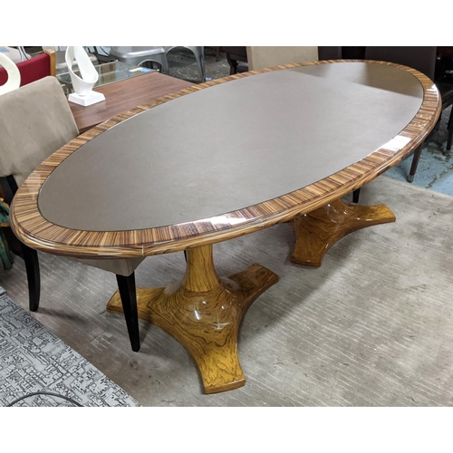 443 - TABLE, 108cm D x 220cm L x 75cm H, oval inlaid leather top, oversized base.