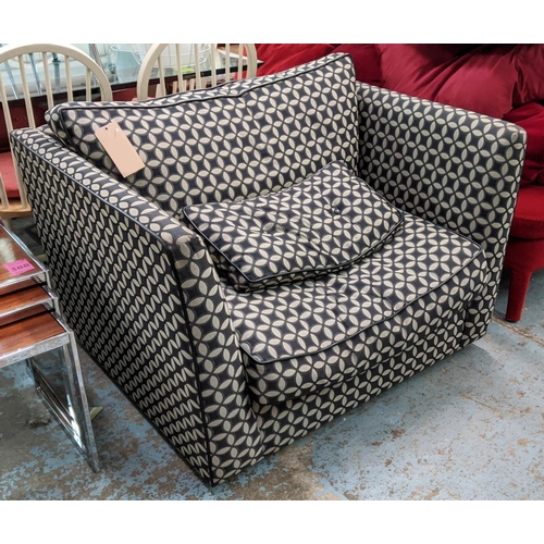 449 - ARMCHAIR, possibly cuddler range, black and grey patterned upholstery leather piping, feather filled... 