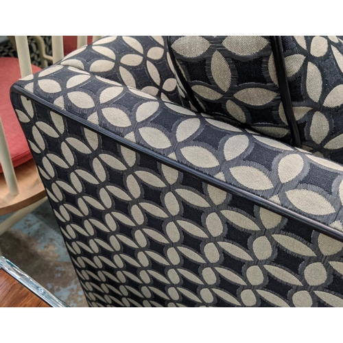 449 - ARMCHAIR, possibly cuddler range, black and grey patterned upholstery leather piping, feather filled... 