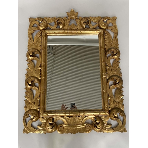 115 - WALL MIRROR, Florentine style carved giltwood with scrolling foliate frame, 86cm W x 115cm H.