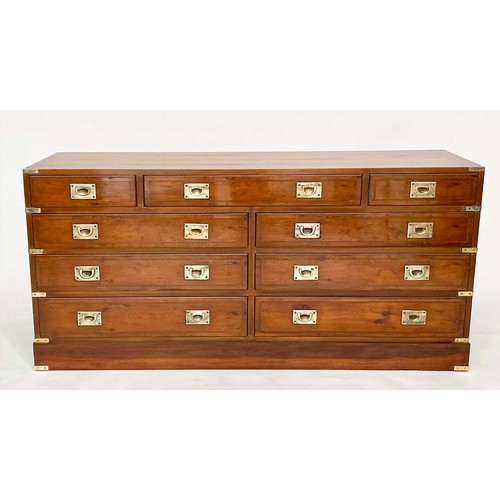 120 - LOW CHEST, Campaign style yewwood and brass bound with nine drawers, 150cm W x 71cm H x 43cm D.