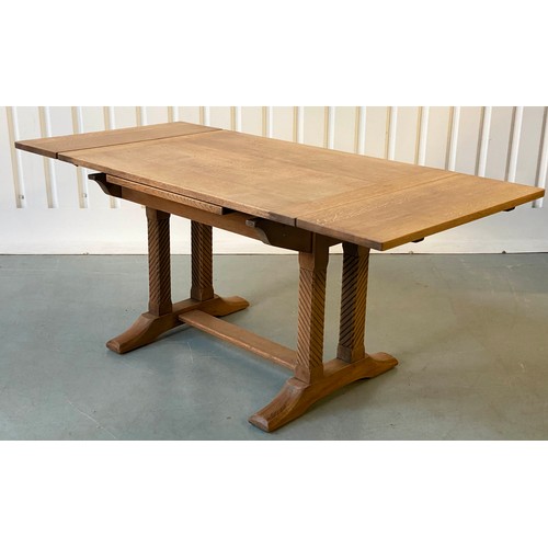 92 - DRAWLEAF EXTENDING DINING TABLE, early 20th century rectangular solid oak and cleated on twin trestl... 