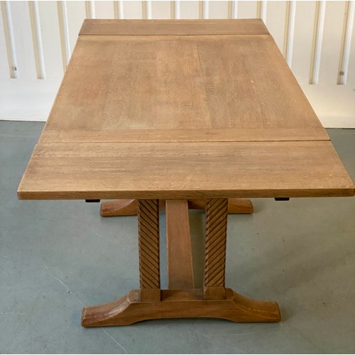 92 - DRAWLEAF EXTENDING DINING TABLE, early 20th century rectangular solid oak and cleated on twin trestl... 