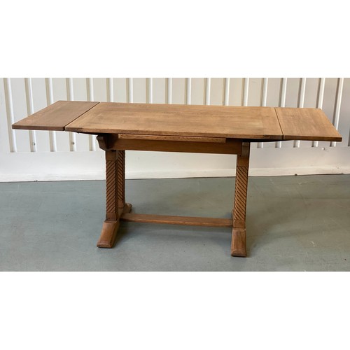 92 - DRAWLEAF EXTENDING DINING TABLE, early 20th century rectangular solid oak and cleated on twin trestl... 